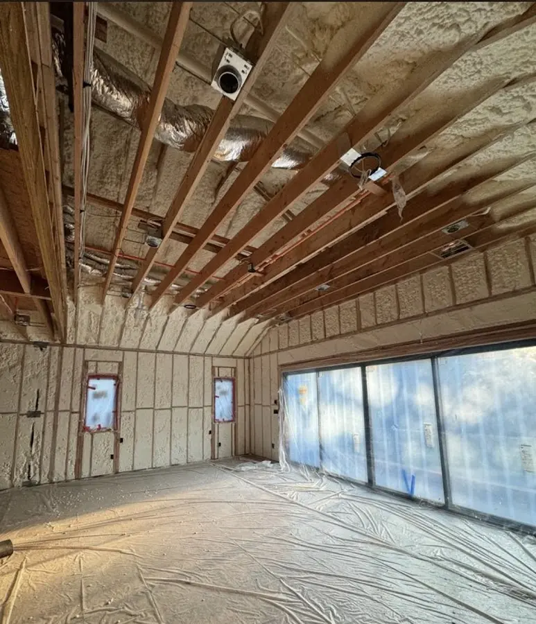 Interior walls and ceiling insulated with spray foam during new construction in Avon
